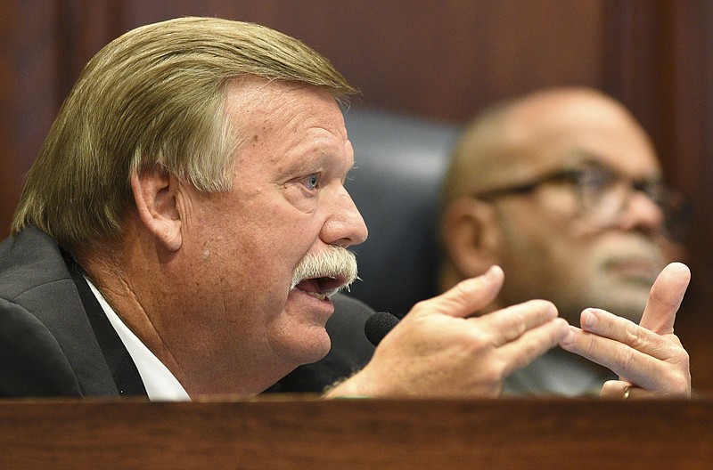 County Mayor Jim Coppinger comments during the meeting.  Listening in the background is County Attorney Rheubin Taylor.  The Hamilton County Commission listened to a presentation and recommendations for short and long-term jail and workhouse overcrowding at the Wednesday meeting in the Hamilton County Courthouse on August 29, 2017.