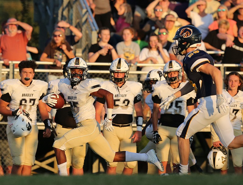 Bradley Central's Lameric Tucker looks for the closest defender as he heads for the end zone during a game against Walker Valley last month. Tucker has committed to UTC and is looking forward to reuniting with former Bears quarterback Cole Copeland with the Mocs.