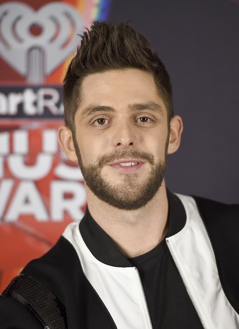 
              FILE - In this March 5, 2017 file photo, Thomas Rhett poses in the press room at the iHeartRadio Music Awards in Inglewood, Calif. At 27, country singer Thomas Rhett is enjoying an abundance of blessings and just trying to make sense of it all. The title track of Rhett’s new album “Life Changes” is his bio put to song as he deals with fame, accolades and becoming a father of two girls. (Photo by Jordan Strauss/Invision/AP, File)
            
