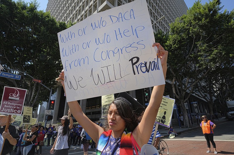 
              Docmary Reyes, 21, a DACA recipient, joins supporters of the Deferred Action for Childhood Arrivals, during a protest march in downtown Los Angeles on Tuesday, Sept. 5, 2017. Almost 800,000 young immigrants who were brought to the U.S. illegally as children or overstayed their visas could see their lives upended after the Trump administration announced Tuesday it is ending the Obama-era program that protected them from deportation.(AP Photo/Richard Vogel)
            