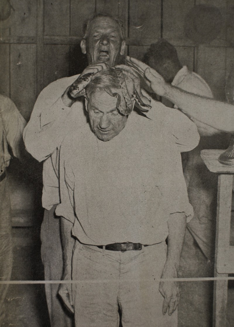 . Caption from the publication, Tennessee Snake Handlers by J.B. Collins ; former Chattanooga News Free Press journalist. : "FOUNDER OF THE FAITH - Preacher George Hensley, who founded the snake-handling faith near Dolley Pond in 1909, allows brethren to fashion a crown of snakes."