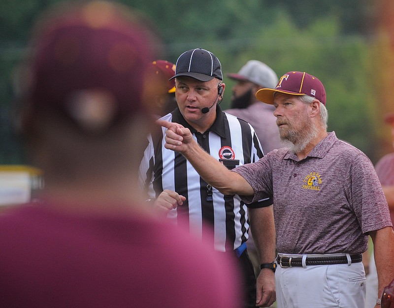 
Tyner High School Head Coach Wayne Turner discusses a call with a referee during the game against Notre Dame on August 26, 2016.