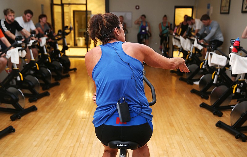 Marsha Goldberg, gives instruction to her spin class Wednesday, Aug. 31, 2017, at the downtown YMCA in Chattanooga, Tenn. Goldberg, who is a local fitness instructor, will be competing in the Ironman.