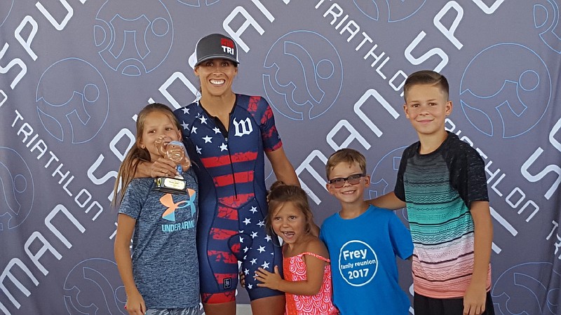 Tiffany Blair poses with her four children — from left, Brooklyn, 9, Kaiya, 5, Rylon, 7 and Peyton, 10 — after a victory in Spudman, a triathlon in Idaho. 