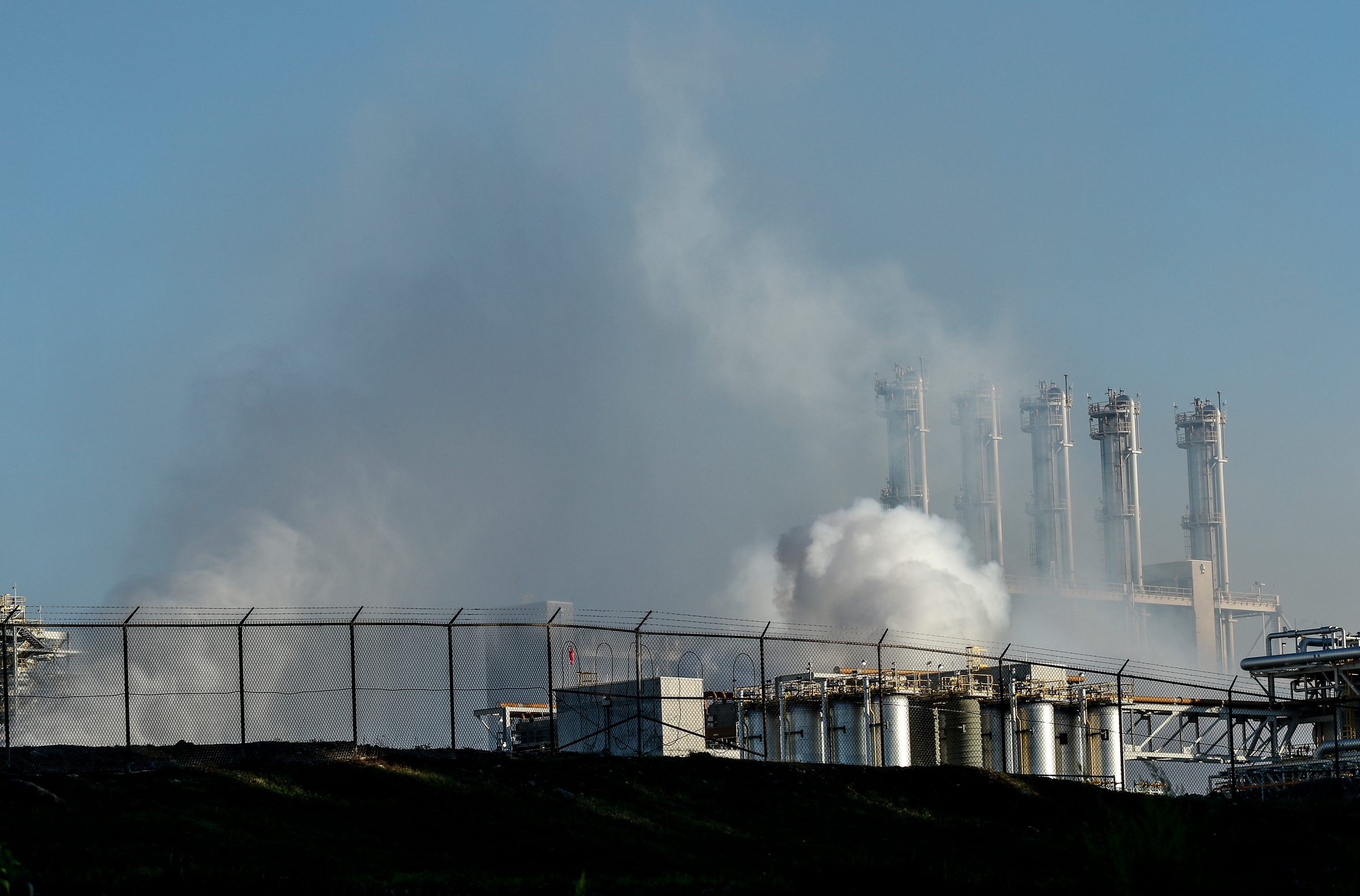 Clouds billow from the Wacker polysilicon chemical plant after an explosion released a hydrogen chemical gas on Thursday, Sept. 7, 2017, in Charleston, Tenn. The explosion closed the plant, but a statement from Wacker says air quality was unaffected.