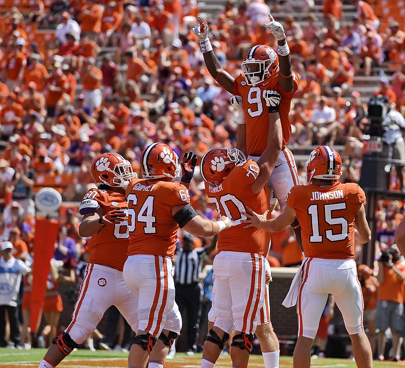 Clemson's Travis Etienne (9) celebrates his fourth-quarter touchdown during last week's 56-3 win against Kent State. Clemson welcomes another set of Tigers this weekend as Auburn visits for an ACC-SEC matchup.