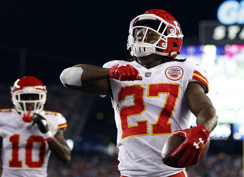 
              Kansas City Chiefs running back Kareem Hunt (27) celebrates his touchdown against the New England Patriots during the first half of an NFL football game, Thursday, Sept. 7, 2017, in Foxborough, Mass. (AP Photo/Michael Dwyer)
            
