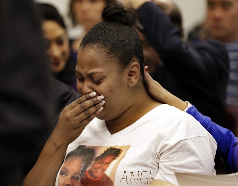 
              FILE - In this Dec. 20, 2013 file photo, Nailah Winkfield, mother of 13-year-old Jahi McMath, cries before a courtroom hearing regarding McMath, in Oakland, Calif. A California judge ruled that McMath, a teen girl declared brain dead more than three years ago after a tonsillectomy, may still be technically alive, allowing a malpractice lawsuit against the hospital to proceed. (AP Photo/Ben Margot, File)
            
