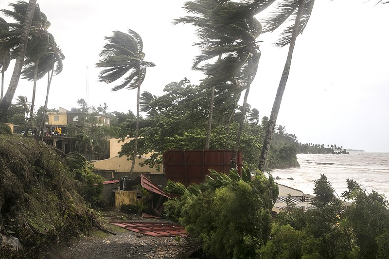 
              Winds brought by Hurricane Irma blow palm trees in Samana, Dominican Republic, Thursday, Sept. 7, 2017. Irma cut a path of devastation across the northern Caribbean, leaving thousands homeless after destroying buildings and uprooting trees. Irma is flooding parts of the Dominican Republic as it roars by just off the northern coast of the island it shares with Haiti. (AP Photo/Tatiana Fernandez)
            
