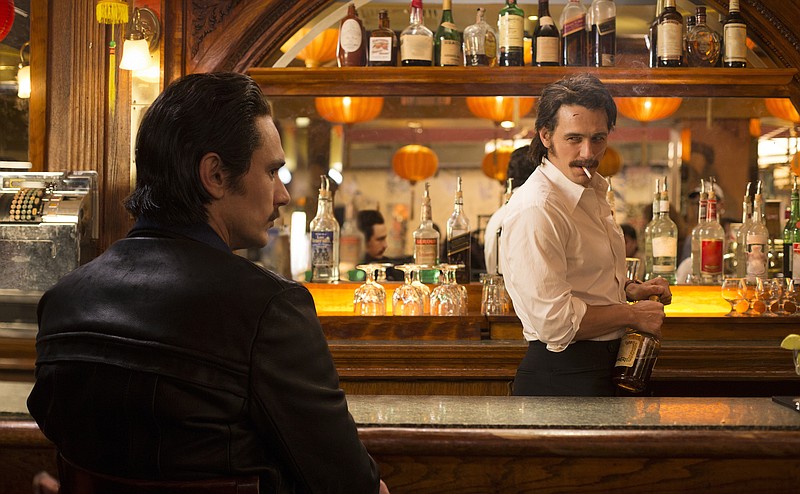 
              This image released by HBO shows James Franco portraying twins Vincent and Frankie Martino in, "The Deuce," a new HBO series about Times Square in the early 1970s. (HBO via AP)
            