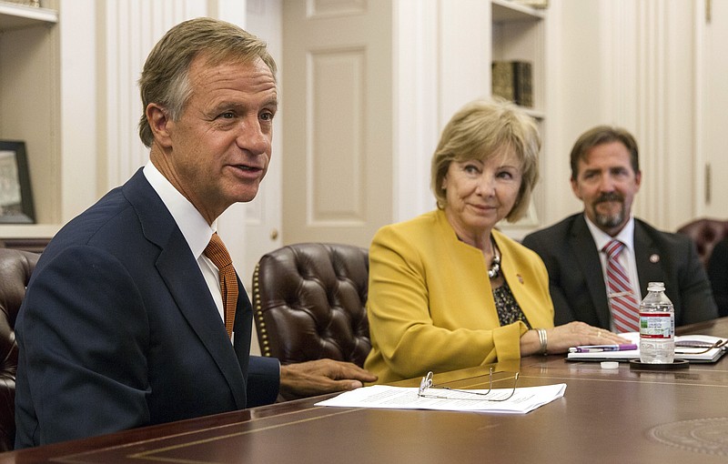 
              Tennessee Gov. Bill Haslam speaks at a press conference at the state Capitol in Nashville, Tenn., on Friday, Sept. 8, 2017, about a federal judge dismissing a longstanding lawsuit over the state's treatment of people with intellectual and developmental disabilities. To his right are Commissioner Debra K. Payne and Assistant Commissioner Jordan Allen of the state Department of Intellectual and Developmental Disabilities. (AP Photo/Erik Schelzig)
            