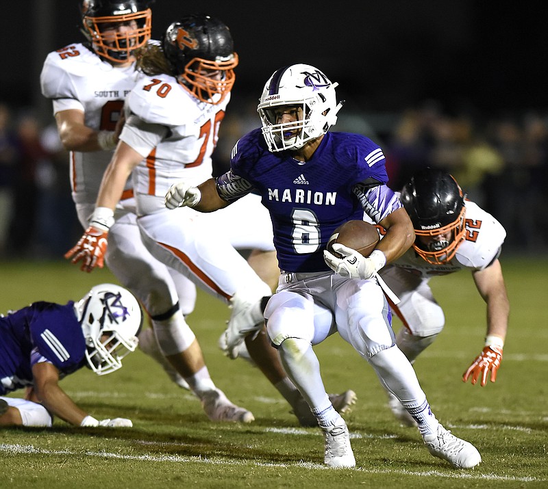 Marion County's Jacob Saylors (8) runs around end.  The South Pittsburg Pirates visited the Marion County Warriors in TSSAA football action of September 8, 2017. 