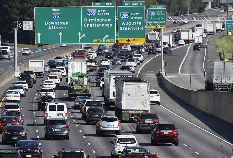 
              Heavy traffic traveling north bound on Interstate 75 moves slowly, as a major evacuation has begun in preparation for Hurricane Irma, Friday, Sept. 8, 2017, in Forrest Park, south of Atlanta.  (AP Photo/Mike Stewart)
            