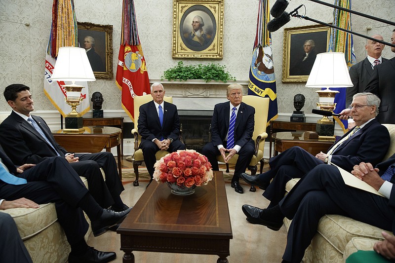 
              In this Sept. 6, 2017, photo, President Donald Trump pauses during a meeting with Congressional leaders in the Oval Office of the White House, Wednesday, Sept. 6, 2017, in Washington. From left, Speaker of the House Paul Ryan, R-Wis., Vice President Mike Pence, Trump, and Senate Majority Leader Mitch McConnell, R-Ky. The tortured relationship between Trump and Ryan has gone cool again, with the Republican president making clear he has no qualms about bucking the GOP leader to cut deals with his Democratic foes. (AP Photo/Evan Vucci)
            