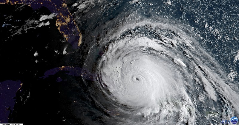 
              In this geocolor image GOES-16 satellite image taken Friday, Sept. 8, 2017, at 11:45 UTC, sunlight, from the right, illuminates Hurricane Irma as the storm approaches Cuba and Florida. Cuba evacuated tourists from beachside resorts and Floridians emptied stores of plywood and bottled water after Hurricane Irma left at least 20 people dead and thousands homeless on a devastated string of Caribbean islands and spun toward Florida for what could be a catastrophic blow this weekend.  (NOAA via AP)
            