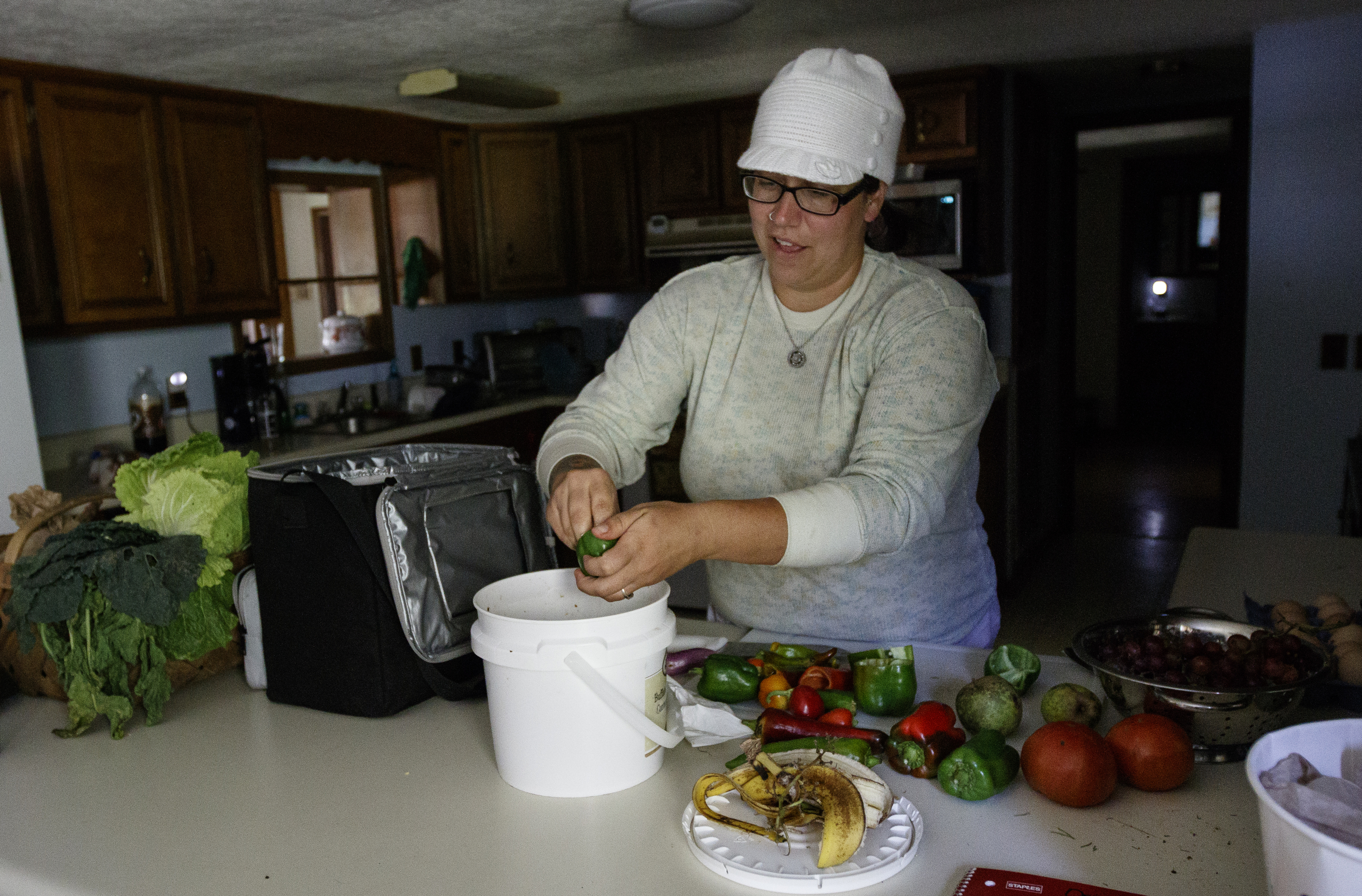 Jessie Gantt-Temple breaks up vegetables to feed to chickens on the farm she runs with her husband Robert Temple on Friday, Sept. 8, 2017, in Soddy-Daisy, Tenn. The farm rotates the where their chickens are housed to help maintain sanitary conditions and prevent growth of infectious bacteria like salmonella.