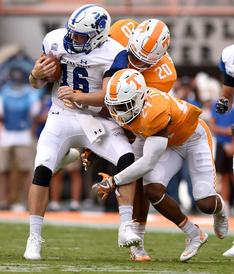 Tennessee's Cortez McDowell (20) and Todd Kelly Jr. (24) stop Indiana State quarterback Cade Sparks (16) for a loss.  The Indiana State Sycamores visited the University of Tennessee Volunteers at Neyland Stadium in NCAA football action of September 9, 2017. 
