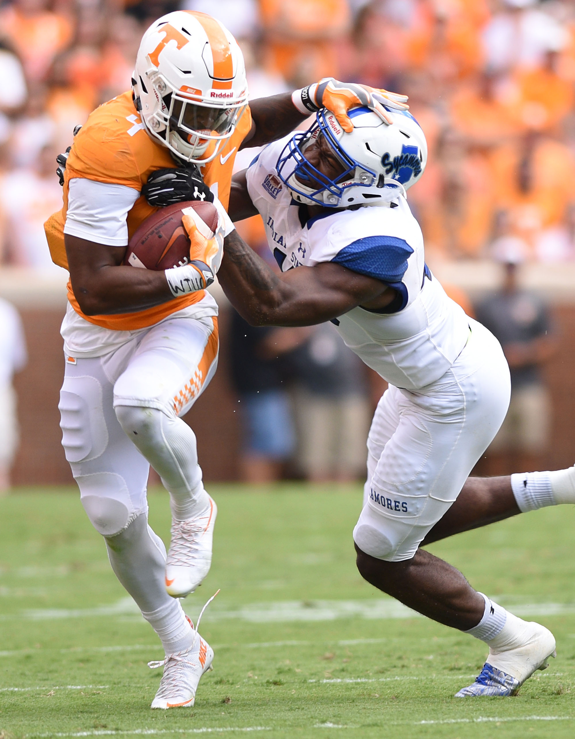 Tennessee's John Kelly (4) tries to shake loose of Indiana State's Jonas Griffith (46). The Indiana State Sycamores visited the University of Tennessee Volunteers at Neyland Stadium in NCAA football action of September 9, 2017.