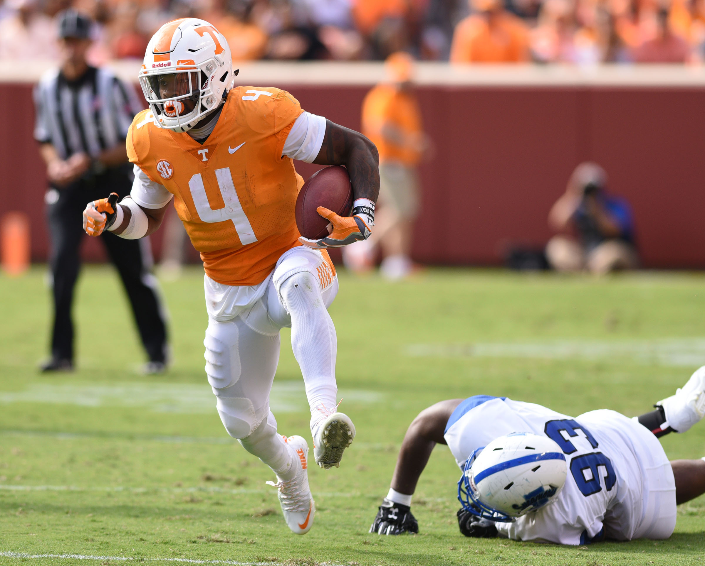Tennessee's John Kelly (4) breaks a tackle for a long gain. The Indiana State Sycamores visited the University of Tennessee Volunteers at Neyland Stadium in NCAA football action of September 9, 2017.