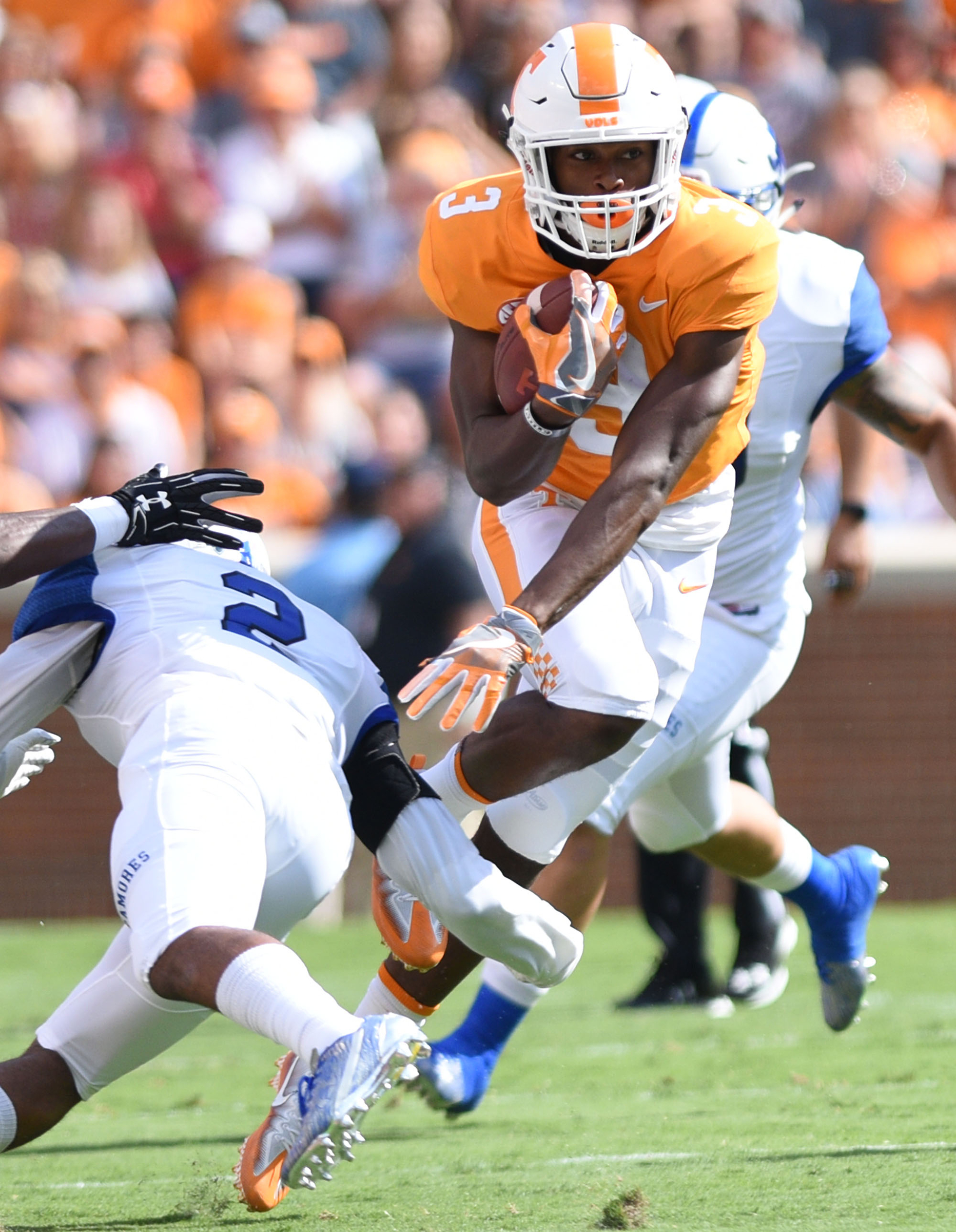 Tennessee's Ty Chandler (3) tries to avoid the tackle of Indiana State's Lonnie Walker II (2). The Indiana State Sycamores visited the University of Tennessee Volunteers at Neyland Stadium in NCAA football action of September 9, 2017.