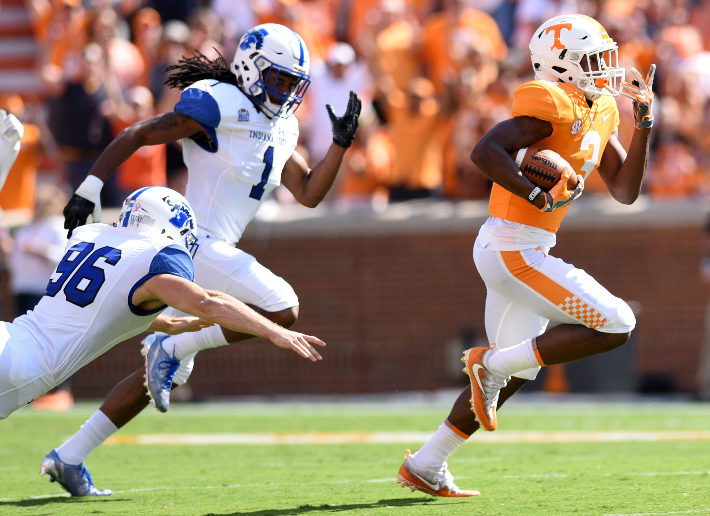 Tennessee's Ty Chandler breaks into the open on the way to a 91-yard kickoff return on the first play of Saturday's game at Neyland Stadium, a 42-7 win for the host Volunteers.