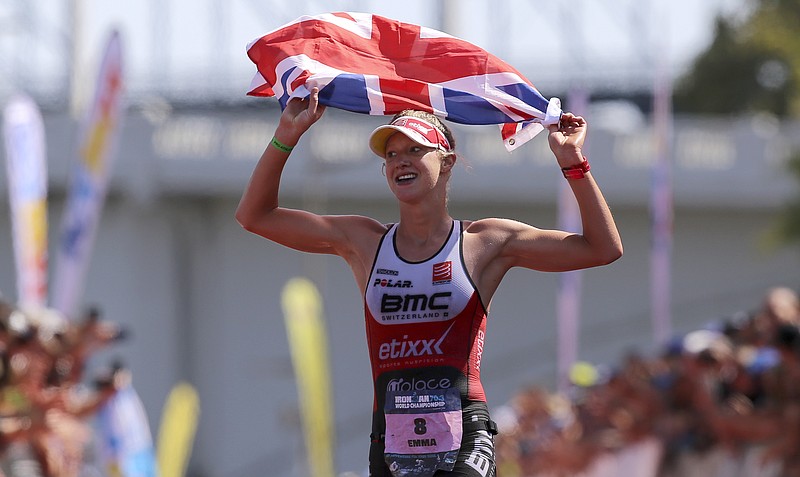 Great Britain's Emma Pallant carries a Union Jack as she nears the finish line during the IcyHot Ironman 70.3 World Championship on Saturday, Sept. 9, in Chattanooga, Tenn. Pallant would finish second behind Switzerland's Daniela Ryf.