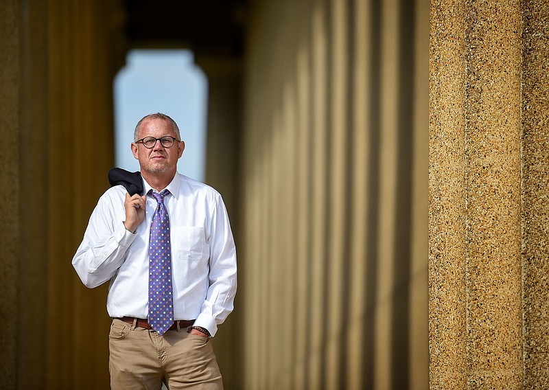 
              Dr. Stephen Loyd, Tennessee’s assistant commissioner overseeing the substance abuse services department,  poses for a portrait at the Parthenon in Centennial Park in Nashville, Tenn., on Aug. 30, 2017. At one time in his life,  Loyd battled a 100-pain-pills-a-day habit after medical school.   (Lacy Atkins /The Tennessean via AP)
            