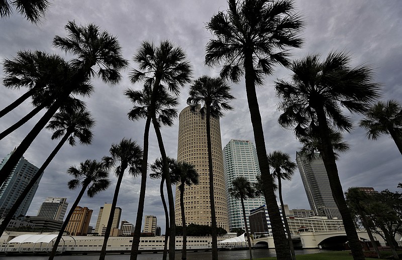 
              Storm clouds associated with the outer bands of Hurricane Irma shroud the downtown skyline Saturday, Sept. 9, 2017, in Tampa, Fla. Several parts of the Tampa Bay area are under a mandatory evacuation order for the approaching storm. (AP Photo/Chris O'Meara)
            