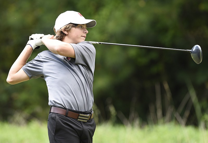 Signal Mountain's Foster Wood follows through on his drive on the 18th hole during the City Prep golf tournament last week at the Bear Trace at Harrison Bay.