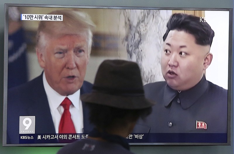 
              FILE - In this Aug. 10, 2017, file photo, a man watches a television screen showing U.S. President Donald Trump and North Korean leader Kim Jong Un during a news program at the Seoul Train Station in Seoul, South Korea. North Korea said Monday, Sept. 11, 2017 it will make the United States pay a heavy price if a proposal Washington is backing to impose the toughest sanctions ever on Pyongyang is approved by the U.N. Security Council this week. (AP Photo/Ahn Young-joon, File)
            