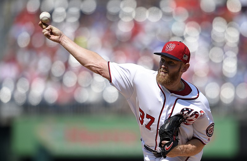 
              Washington Nationals starting pitcher Stephen Strasburg delivers during the second inning of a baseball game against the Philadelphia Phillies, Sunday, Sept. 10, 2017, in Washington. (AP Photo/Nick Wass)
            