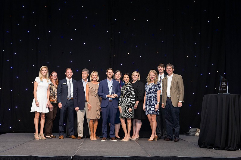Members of the Downtown Council of the Chattanooga Chamber of Commerce accept the award for Council of the Year. From left are Honor Hostetler, Julie Alcantara, Justin Whitaker, Brad Cansler, Beth Harrell, Joey Greer, Tonya Cammon, Patti Frierson, Lesley Berryhill, Amanda Elmendorf, Wilson Meads and Peter Lindeman. (Contributed photo by Kristen Jeffers)