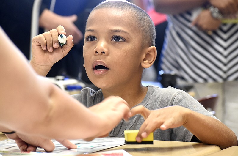 Marquise McMurray listens to the instruction of teacher Ashley Lepard of East Side Elementary while they are observed by Hamilton County elementary principals. Hamilton County's elementary principals gathered at Hardy Elementary to learn new tips for boosting literacy throughout their schools last June.