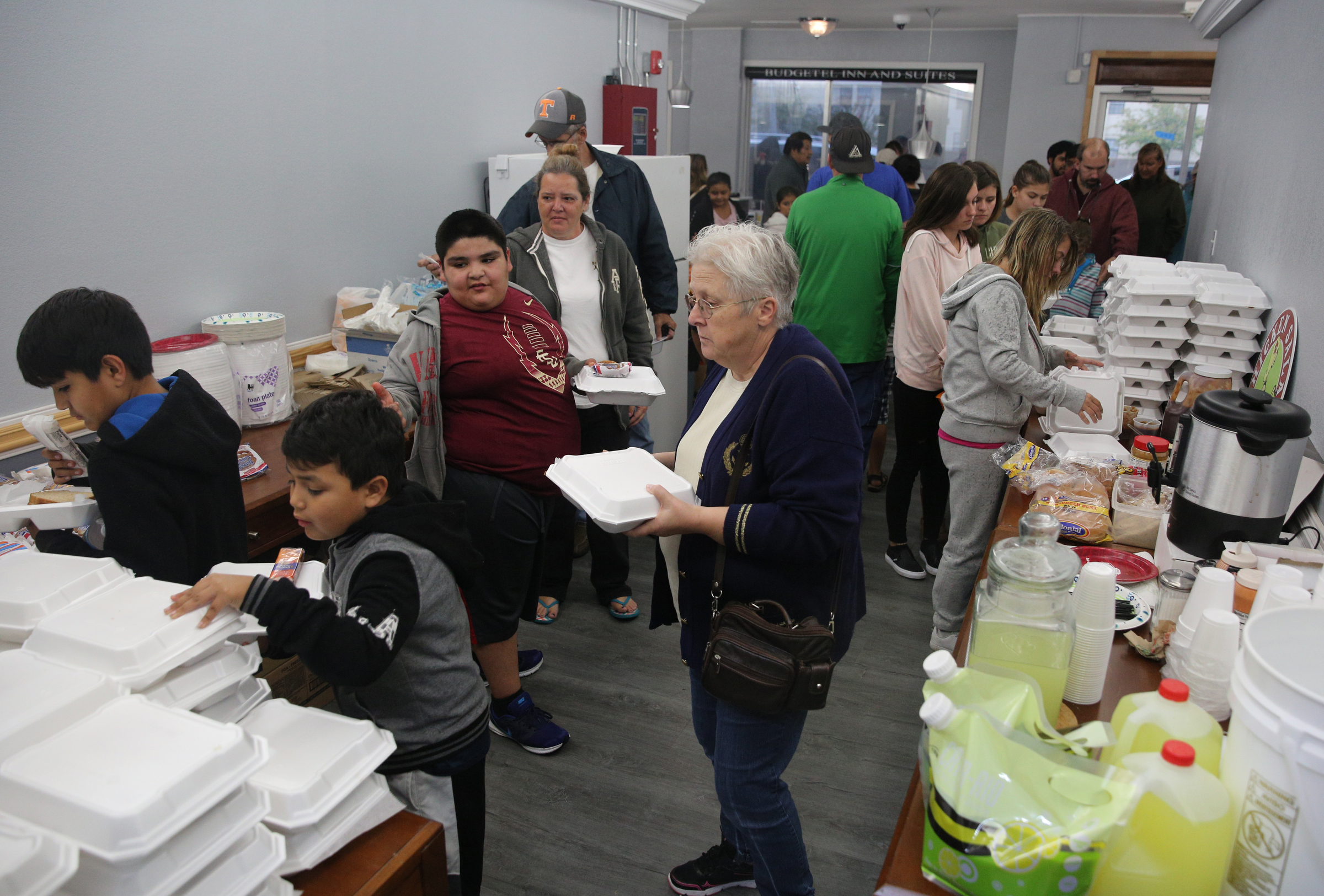 The lobby of the the Budgetel Inn in East Ridge, Tenn., fills with those stranded from Hurricane Irma as they get food donated by local churches and businesses Monday, Sept. 11, 2017. About 300 guests were staying in the hotel Monday night after driving from Florida to flee the storm.