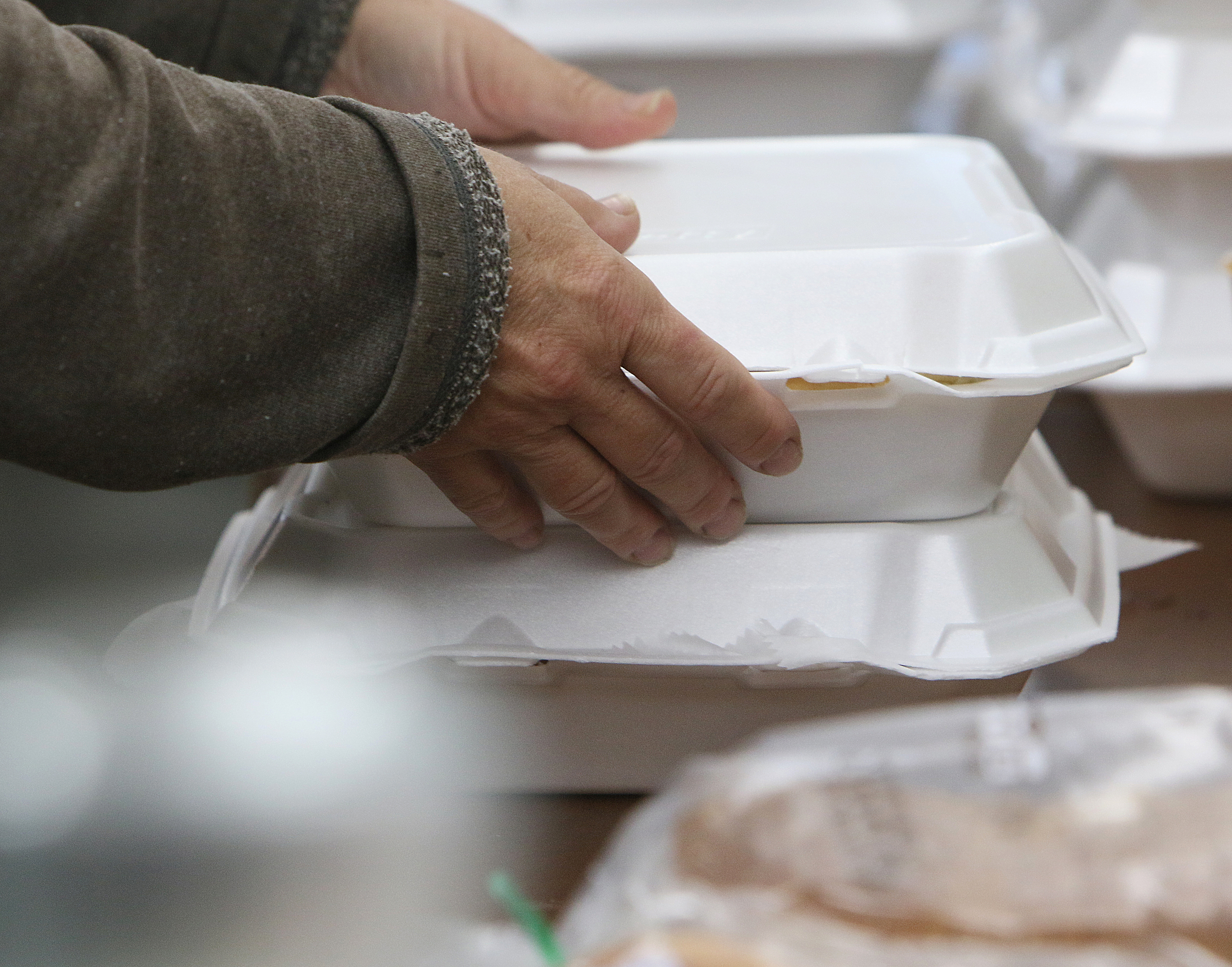 Individuals receiving shelter at the Budgetel Inn in East Ridge, Tenn., grab boxes of barbecue donated by East Ridge United Methodist Church and Jones Memorial Methodist Church Monday, Sept. 11, 2017. A variety of other businesses and churches donated food for those fleeing Irma.