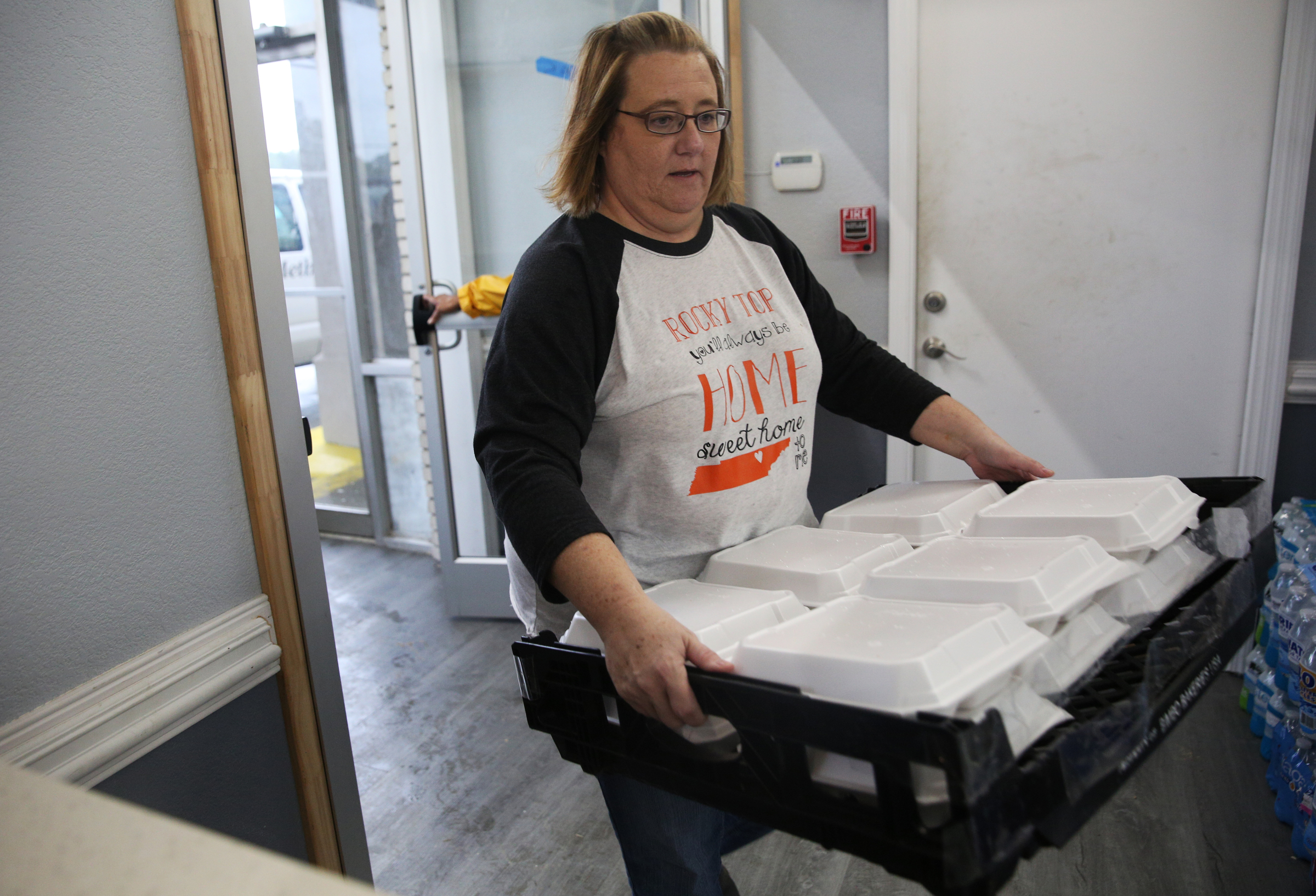 Glenda Bonner with East Ridge United Methodist Church unloads a pallet of barbecue for guests fleeing Hurricane Irma Monday, Sept. 11, 2017, at the Budgetel Inn in East Ridge, Tenn. East Ridge United Methodist Church and Jones Memorial United Methodist Church worked together to provide barbecue dinners for those staying at the hotel.