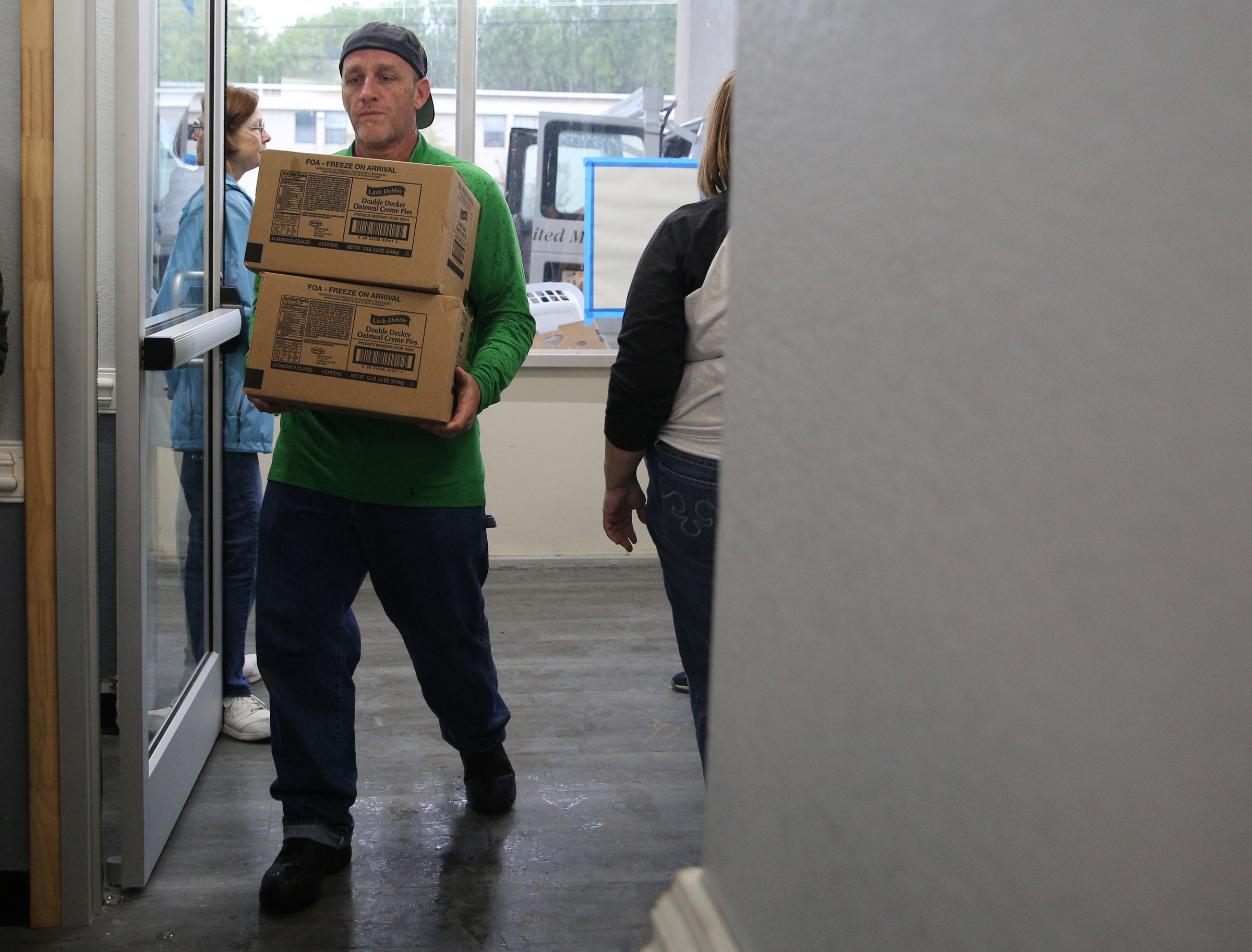 Casey Steinman, general manager, unloads boxes of food that were donated by East Ridge United Methodist Church and Jones Memorial Methodist Church Monday, Sept. 11, 2017, at the Budgetel Inn in East Ridge, Tenn. Steinman opened the hotel to those fleeing Florida and sought out donations from he community to help feed them.