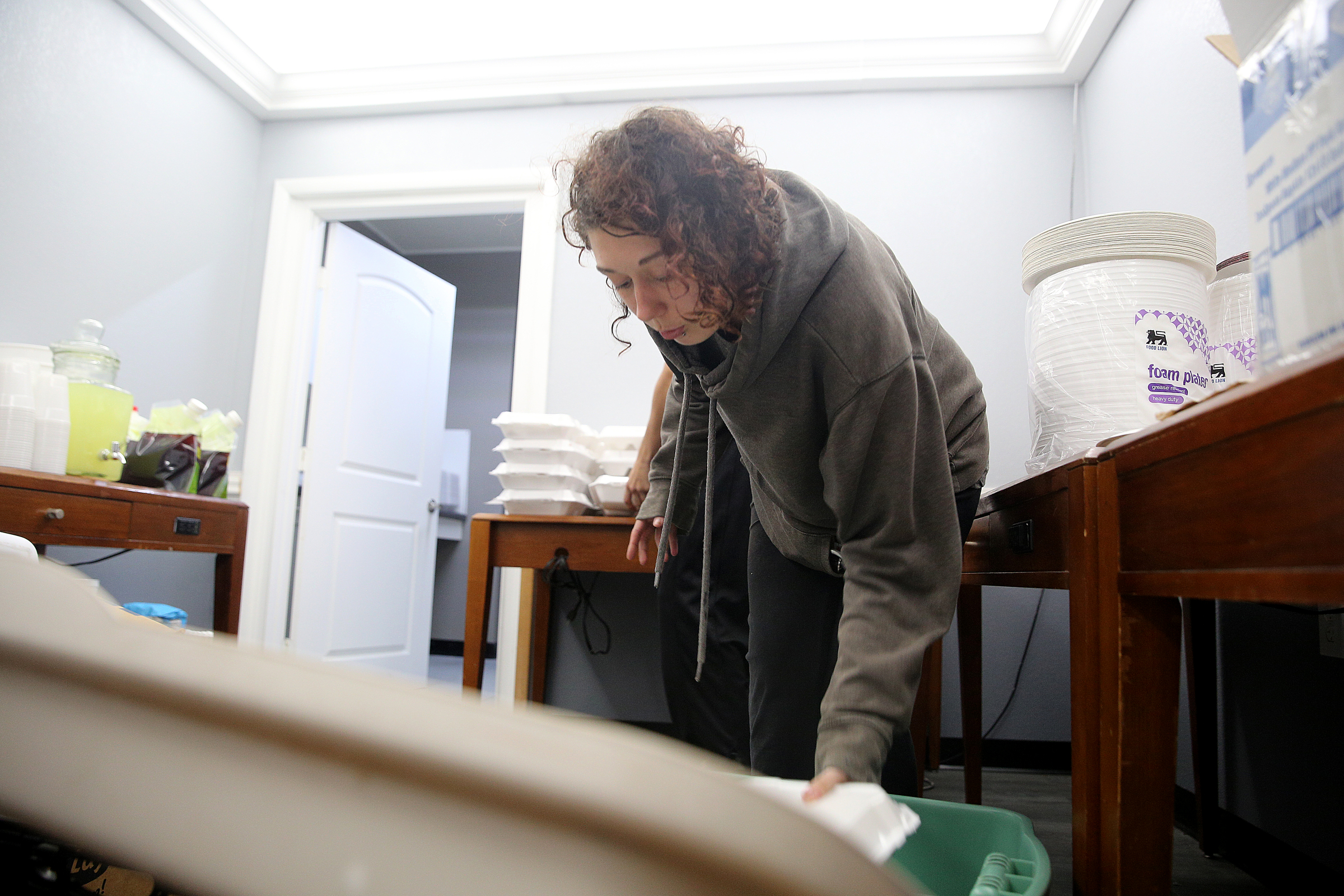 Kailyn Golub of Naples, Fla., helps unload boxes of barbecue Monday, Sept. 11, 2017, at the Budgetel Inn in East Ridge, Tenn. Golub fled Florida with a friend to get out of the path of the hurricane.