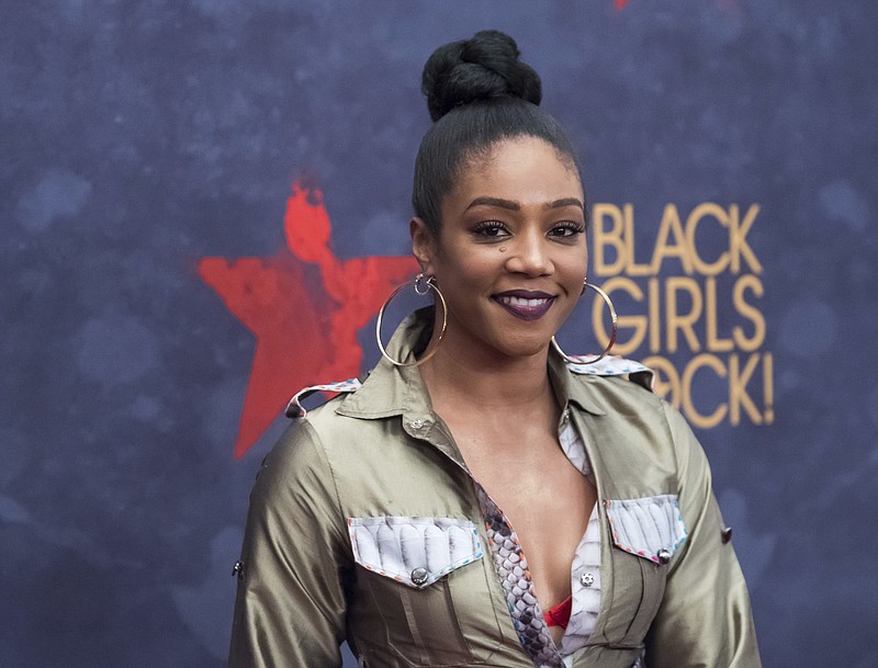 
              In this Aug. 5, 2017, photo, Tiffany Haddish attends the Black Girls Rock! Awards at the New Jersey Performing Arts Center in Newark, N.J. Actress and comedian Haddish is having a full-circle moment. The breakout star of the summer movie hit "Girls Trip" launched her career on "Def Comedy Jam," the long-running HBO series spotlighting black comics, and now she's appearing on its 25th anniversary tribute. (Photo by Charles Sykes/Invision/AP)
            