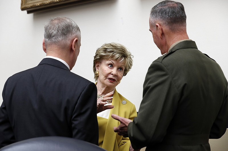 
              FILE - In this June 12, 2017, file photo, Defense Secretary Jim Mattis, from left, Delegate Madeleine Bordallo, D-Guam, and Joint Chiefs Chairman Gen. Joseph Dunford, talk before a House Armed Services Committee on Capitol Hill in Washington. The House Ethics Committee said Sept. 11, it will continue a review of Bordallo who potentially profited from a foreign government through the rental of a home. In its announcement, the committee also released recommendations from the Office of Congressional Ethics which found “substantial reason to believe” Bordallo rented the home in Guam to the Japanese Consulate. (AP Photo/Alex Brandon, File)
            