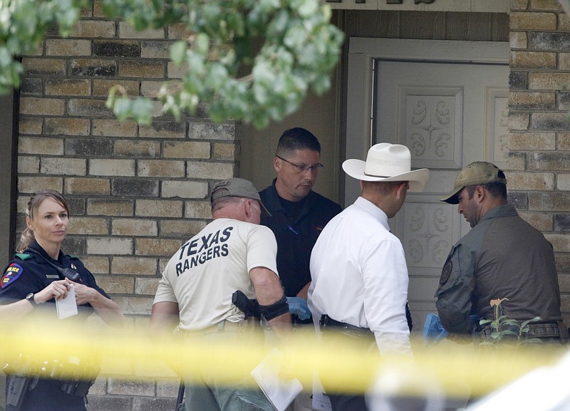 
              Plano police and the Texas Rangers work the scene of a shooting at a home in the 1700 block of West Spring Creek Parkway in Plano, Texas, Monday, Sept. 11, 2017. Multiple people were fatally shot to death, and their attacker was killed by a police officer Sunday night, authorities said. (David Woo/The Dallas Morning News via AP)
            