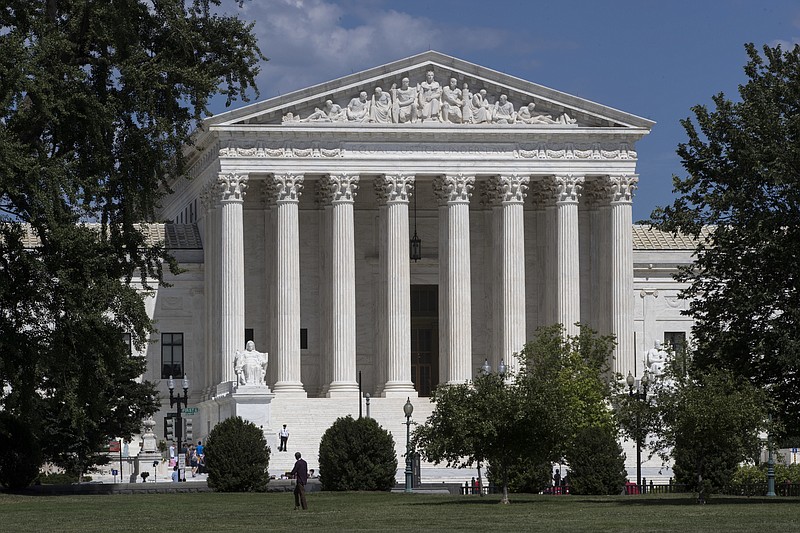 
              In this June 26, 2017 file photo, The Supreme Court is seen on the last day of its term, in Washington.  The Trump administration is back at the Supreme Court, asking the justices to continue to allow strict enforcement of a temporary ban on refugees from around the world. The Justice Department’s high court filing Monday follows an appeals court ruling last week that would allow refugees to enter the United States if a resettlement agency in the U.S. had agreed to take them in.  (AP Photo/J. Scott Applewhite)
            