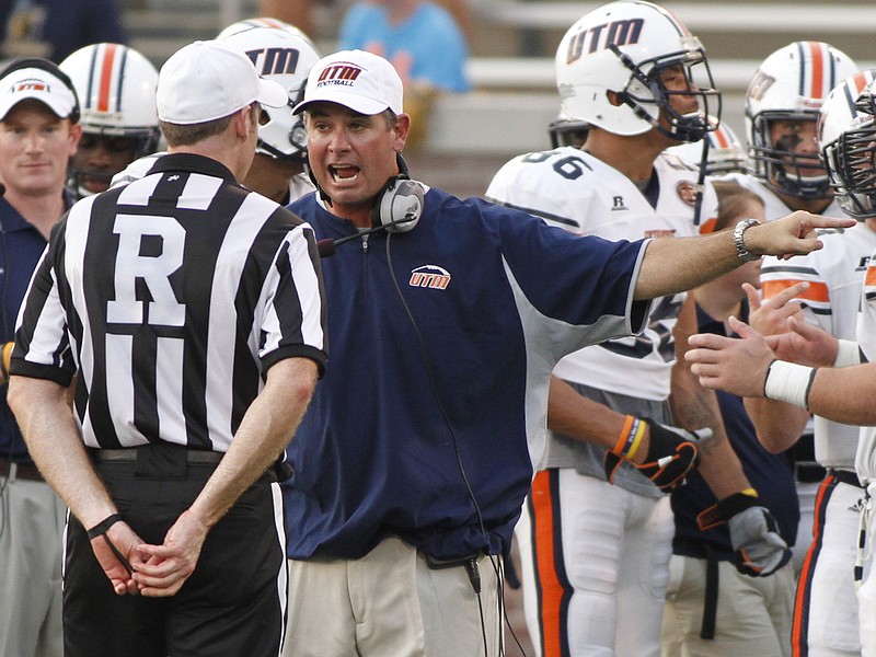 In this Thursday, Aug. 29, 2013, file photo, UT-Martin head coach Jason Simpson shouts at a referee during the Mocs' season opening football game against the Skyhawks at Finley Stadium in Chattanooga.