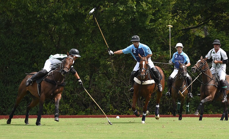 Julio Arellano makes a shot under pressure from the visiting team's Francisco Bilboa during last September's polo match at Bendabout Farm. Arellano will play this weekend in U.S. vs. Argentina matches.