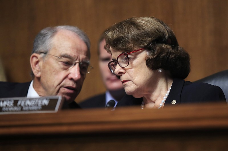 Senate Judiciary Committee Chairman Sen. Charles Grassley, R-Iowa, left, confers with ranking member, Sen. Dianne Feinstein, D-Calif., during a recent hearing on Capitol Hill in Washington.