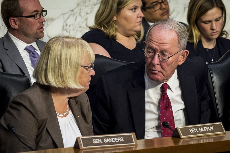 Sens. Lamar Alexander, R-Tenn., and Patty Murray, D-Wash., confer as state insurance commissioners appear last week before the Senate health committee about ways to stabilize the federal health law. on Capitol Hill in Washington last week. Alexander said Wednesday that he hoped the panel would soon reach a consensus to stabilize health insurance markets and prevent prices from skyrocketing next year under the Affordable Care Act. (Pete Marovich/The New York Times)