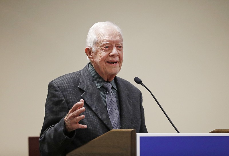 
              FILE - In this Sept. 15, 2016, file photo, former President Jimmy Carter speaks at a Baptist conference in Atlanta. Carter says the U.S. functions more like an "oligarchy than a democracy," and he is sharply critical of U.S. foreign policy under President Donald Trump. He made his remarks Tuesday, Sept. 12, 2017, to several hundred supporters of his post-presidency Carter Center in Atlanta. (AP Photo/David Goldman, File)
            