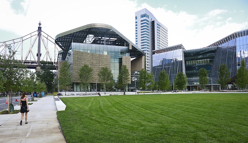 
              This Aug. 16, 2017, photo shows the main buildings of Cornell Tech - the main academic building called the Bloomberg Center, left, a 26-story residence hall, center, and a programs building called the Bridge, right, on Roosevelt Island in New York. The new graduate school that backers hope will cement New York's status as a center of high-tech innovation officially opens Wednesday, Sept. 13. The school called Cornell Tech is the product of a competition former Mayor Michael Bloomberg announced in 2011. (AP Photo/Bebeto Matthews)
            