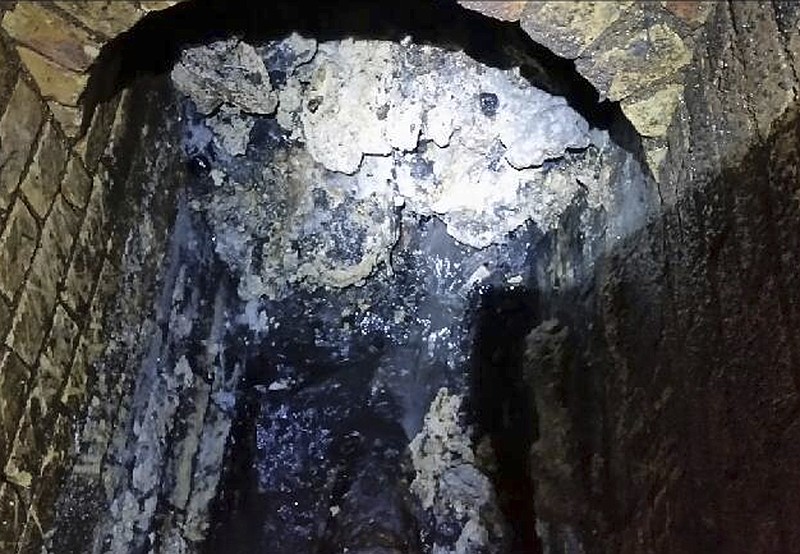 
              In this undated handout photo issued by Thames Water on Tuesday, Sept. 12, 2017, a view of a fatberg inside a sewer in Whitechapel, London. British engineers say they have launched a “sewer war” against a giant fat blob clogging London’s sewers. Thames Water officials said Tuesday it is likely to take three weeks to dissolve the outsize fatberg. (Thames Water via AP)
            