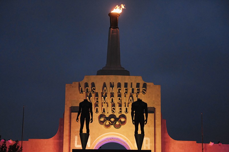 
              A blazing Olympic cauldron is seen at the Los Angeles Memorial Coliseum on Wednesday, Sept. 13, 2017. The cauldron was lit early Wednesday morning at the stadium that was the site of the 1932 and 1984 Olympics. An International Olympic Committee meeting in Peru is to make it official that LA will host in 2028 and that the 2024 Games will go to Paris. (AP Photo/Richard Vogel)
            